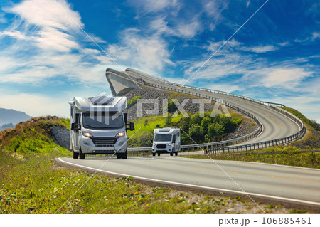 Caravan car RV travels on the highway Atlantic Ocean Road Norway. Caravan car RV travels on the highway Atlantic Ocean Road Norway. 106885461