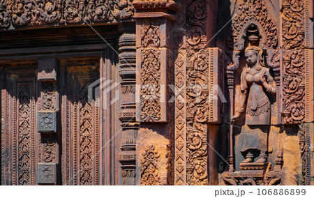 Mysterious Ancient ruins Banteay Srei temple - famous Cambodian landmark, Angkor Wat complex of temples. Siem Reap, Cambodia. Mysterious Ancient ruins Banteay Srei temple - famous Cambodian landmark, Angkor Wat complex of temples. Siem Reap, Cambodia. 106886899