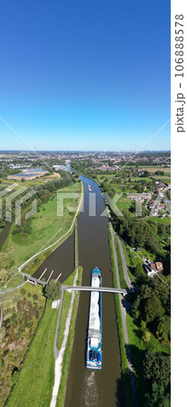 Lembeek, Halle, Vlaams Brabant, Belgium,Sep 5th 2023, cargo ship or barge passing on the Canal Lembeek, Halle, Vlaams Brabant, Belgium,Sep 5th 2023, cargo ship or barge passing on the Canal 106888578