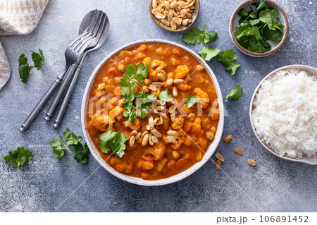 Vegan curry with cauliflower, chickpeas and butternut squash Vegan curry with cauliflower, chickpeas and butternut squash 106891452