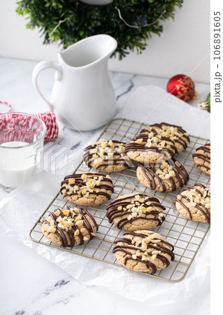 Candied ginger cookies drizzled with chocolate glaze 106891605