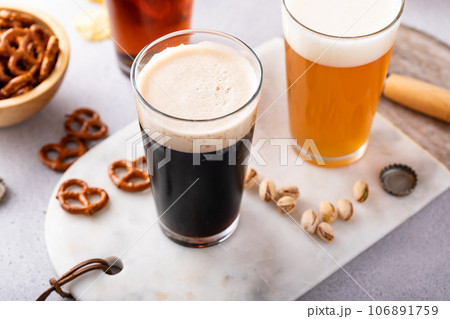 Variety of beer with snacks on the table 106891759