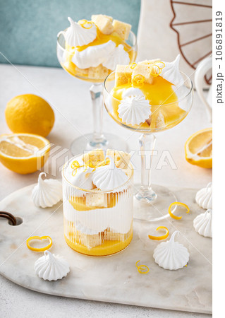 Lemon parfait with pound cake, lemon curd, whipped cream and meringue 106891819