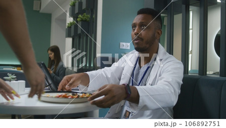 Medic uses digital tablet computer, examines tests results Medic uses digital tablet computer, examines tests results 106892751
