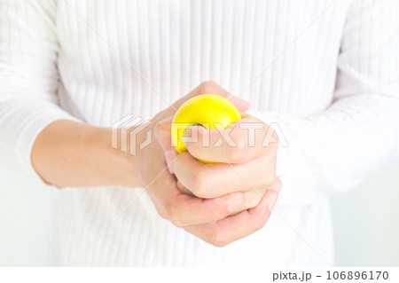 Hands of man with a gentle personality He exhibits stressful behavior from work, and he squeezes the ball expressing emotion, anger, displeasure. Medical concepts and emotional regulation Hands of man with a gentle personality He exhibits stressful behavior from work, and he squeezes the ball expressing emotion, anger, displeasure. Medical concepts and emotional regulation 106896170