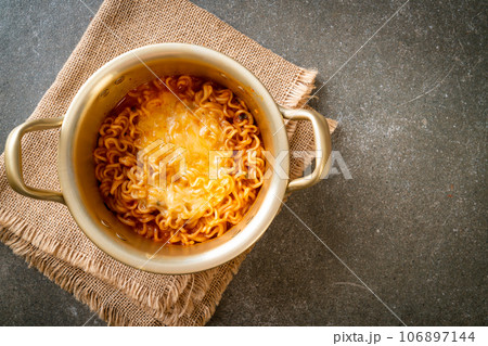 Korean spicy instant noodle with cheese 106897144
