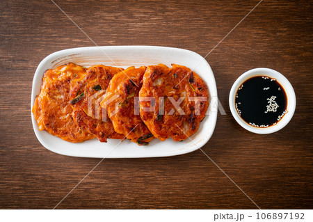 Korean Kimchi pancake or Kimchijeon - Fried Mixed Egg, Kimchi, and Flour Korean Kimchi pancake or Kimchijeon - Fried Mixed Egg, Kimchi, and Flour 106897192