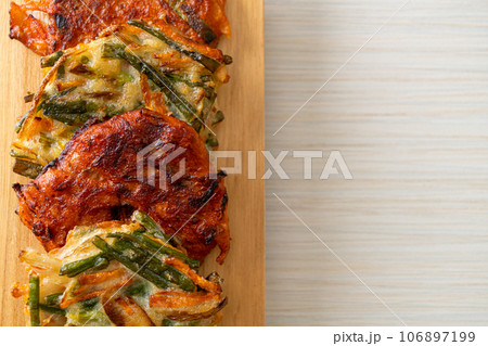 Pajeon or Korean pancake and Korean Kimchi pancake or Kimchijeon on white background Pajeon or Korean pancake and Korean Kimchi pancake or Kimchijeon on white background 106897199