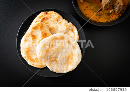 Chicken curry soup with roti Chicken curry soup with roti 106897936