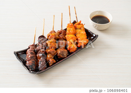 Japanese chicken grill or yakitori serve in izakaya style Japanese chicken grill or yakitori serve in izakaya style 106898401