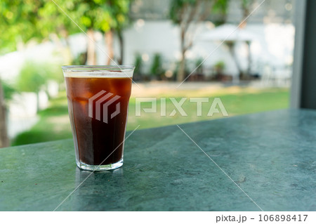 iced americano coffee glass on table iced americano coffee glass on table 106898417