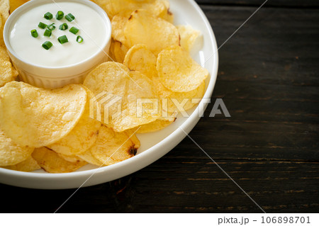potato chips with sour cream potato chips with sour cream 106898701
