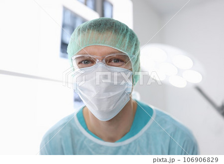 Portrait of male doctor in surgical suit in operating room Portrait of male doctor in surgical suit in operating room 106906829