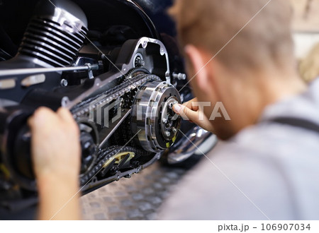 Male service man hold silver key in hand closeup Male service man hold silver key in hand closeup 106907034