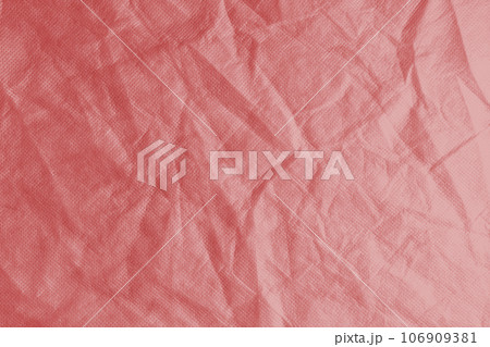 Wrinkled, crumpled red spunbond fabric texture background 106909381