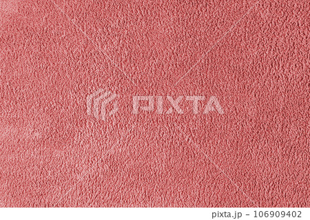 Terry cloth, red towel texture background. Soft fluffy textile bath or beach towel material Terry cloth, red towel texture background. Soft fluffy textile bath or beach towel material 106909402
