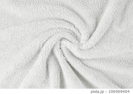 Terry cloth, white towel texture background. Soft fluffy textile bath or beach towel material 106909404