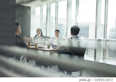 team of asian corporate executives discussing business in conference room team of asian corporate executives discussing business in conference room 106911672