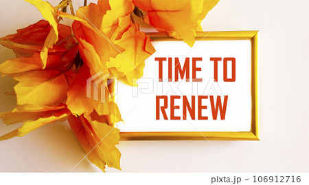 Photo frame with the text It's time to renew on a light background, next to yellow foliage 106912716