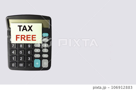 Tax Free text, written on a note that lies on a calculator and a white background. Place for text Tax Free text, written on a note that lies on a calculator and a white background. Place for text 106912883