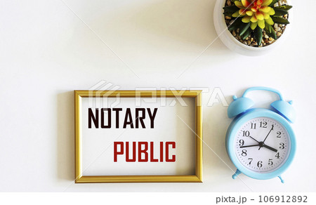 The text NOTARY PUBLIC is written on a photo frame and a white background. Concept meaning Agreement The text NOTARY PUBLIC is written on a photo frame and a white background. Concept meaning Agreement 106912892