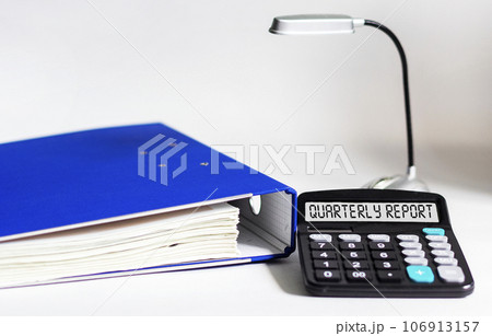Calculator with the word quarterly report on the display. Money, finance and business concept Calculator with the word quarterly report on the display. Money, finance and business concept 106913157