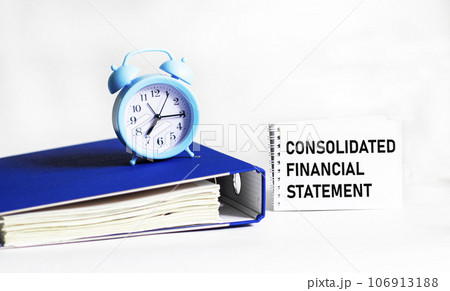 Notepad with message about consolidated financial statements. Conceptual image 106913188