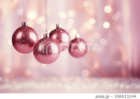 Pink trendy Christmas hanging decorations on pink background 106913244