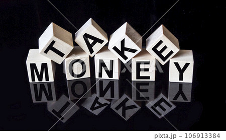 On a black mirrored background with reflection cubes with the text TAKE MONEY On a black mirrored background with reflection cubes with the text TAKE MONEY 106913384