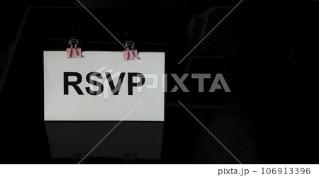 RSVP word written on white sticker and black background RSVP word written on white sticker and black background 106913396