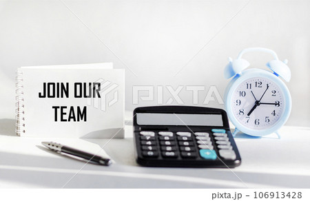 Join our team text on notepad and white background with calculator and clock 106913428