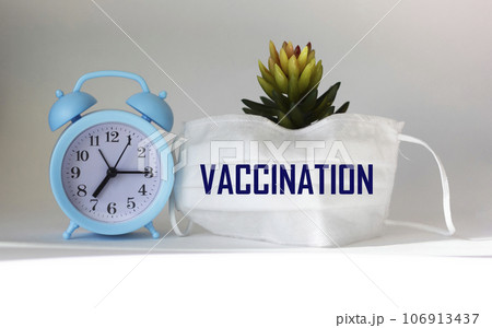Medical mask with vaccination words as a medical concept 106913437