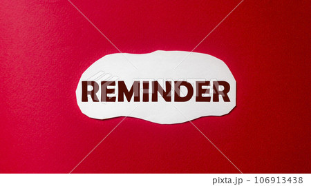 Reminder, text is written on a piece of paper and a red background. Do not forget 106913438