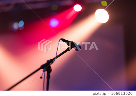 A mic on the stage in spot lights 106913620