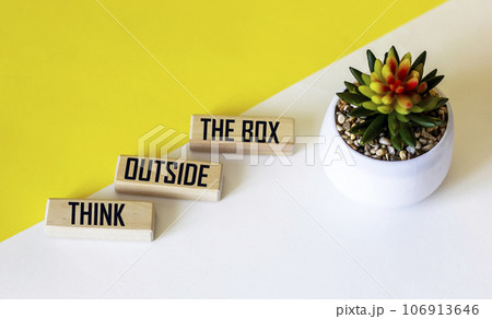 THINK OUTSIDE THE BOX written on wooden blocks. Business concept. 106913646