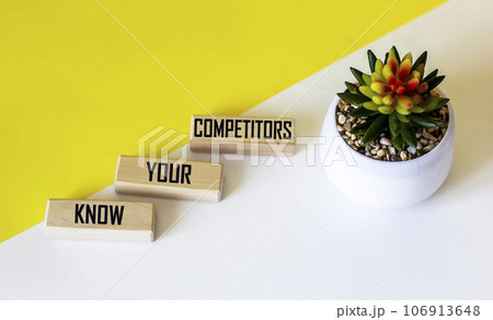 There is a conceptual image on the wooden blocks. Text KNOW THAT YOUR COMPETITORS  106913648