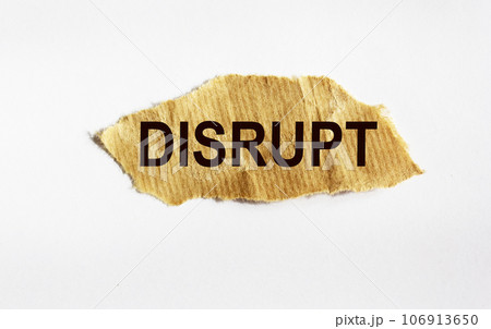 disrupt. text on white paper on torn paper 106913650