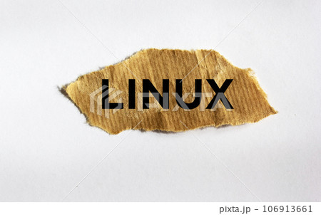 Linux. text on brown torn paper isolated on white background. Linux. text on brown torn paper isolated on white background. 106913661