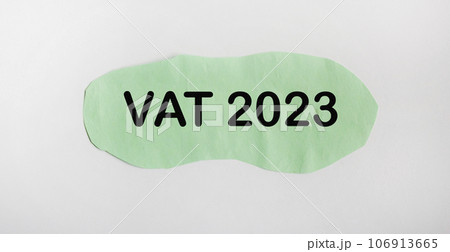 Green paper with the message VAT 2023 on a white background 106913665