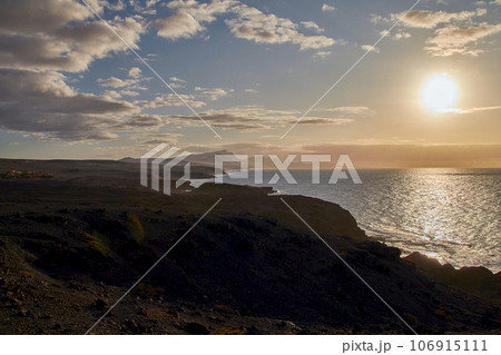 Evening atmosphere on the coast just before sunset near La Pared, Fuerteventura, Canary Islands, Spain 106915111