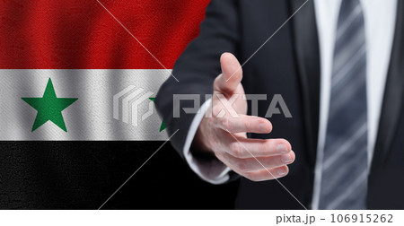 Syrian business, politics, cooperation and travel concept. Hand on flag of Syria background. Syrian business, politics, cooperation and travel concept. Hand on flag of Syria background. 106915262