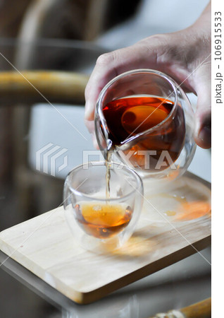 pouring tea or hot tea ,kettle and tea cup or Chinese tea or English tea pouring tea or hot tea ,kettle and tea cup or Chinese tea or English tea 106915533