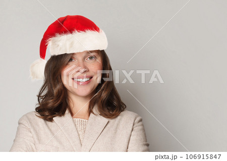 Cute smiling Christmas woman Santa on white background, Xmas portrait 106915847