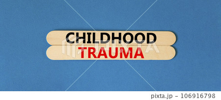 Childhood trauma symbol. Concept words Childhood trauma on beautiful wooden stick. Beautiful blue table blue background. Business psychology childhood trauma concept. Copy space. 106916798