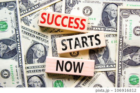 Success starts now symbol. Concept word Success starts now on beautiful wooden block. Dollar bills. Beautiful dollar bills background. Business motivational success starts now concept. Copy space. Success starts now symbol. Concept word Success starts now on beautiful wooden block. Dollar bills. Beautiful dollar bills background. Business motivational success starts now concept. Copy space. 106916812