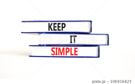 Keep it simple symbol. Concept word Keep it simple on beautiful books. Beautiful white table white background. Business motivational keep it simple concept. Copy space. 106916825