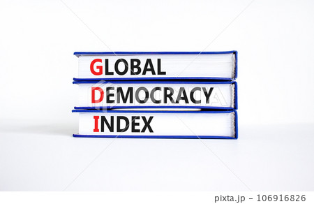 GDI global democracy index symbol. Concept words GDI global democracy index on books on a beautiful white table white background. Business and GDI global democracy index concept. Copy space. 106916826