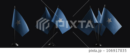 Small national flags of the Somalia on a black background 106917835