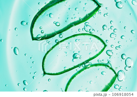 Aloe vera slice texture with gel on blue background. Medicinal plant. Flat lay. Top view. Natural herbal medical plant ,skincare ,healthcare and beauty spa concept. Aloe vera slice texture with gel on blue background. Medicinal plant. Flat lay. Top view. Natural herbal medical plant ,skincare ,healthcare and beauty spa concept. 106918054