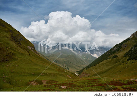 Mountain ranges on a sunny day at Georgia. Sky with clouds adn hills Mountain ranges on a sunny day at Georgia. Sky with clouds adn hills 106918397